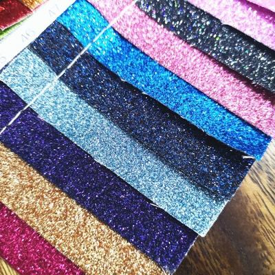 بيع بالجملة PU Glitter Powder Grain الجلد الاصطناعي محفظة المحفظة الأحذية دفتر ملاحظات القماش الجلدي
