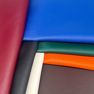 مصنع بيع بالجملة PVC 0.6mm ليتشي نسيج الجلد الزائف الجلد الاصطناعي المصنوع للسيارة كيس مقعد أقدام الزخرفية